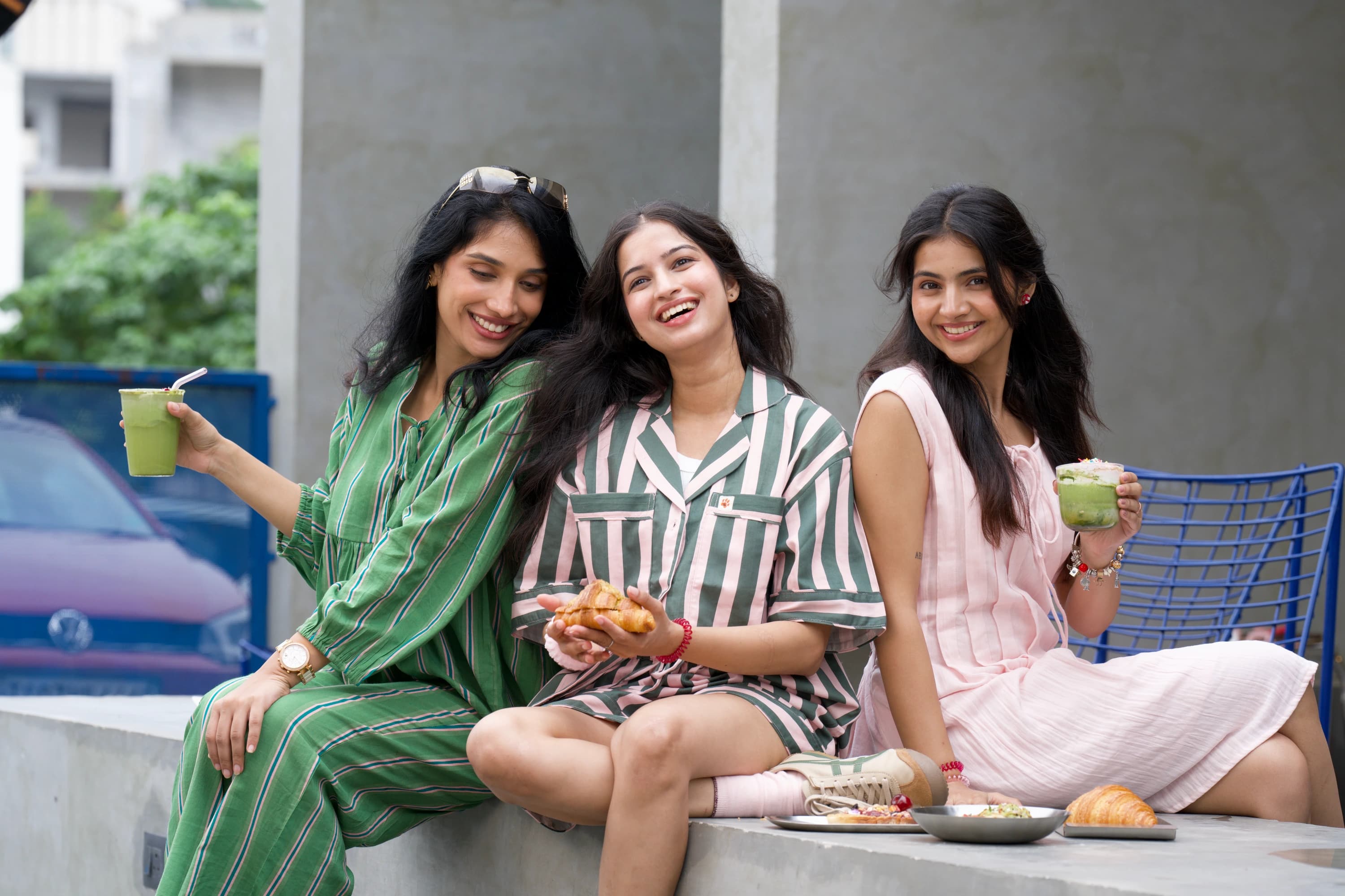 Three friends in Sleeping Tiger sleepwear, out for a slow matcha morning